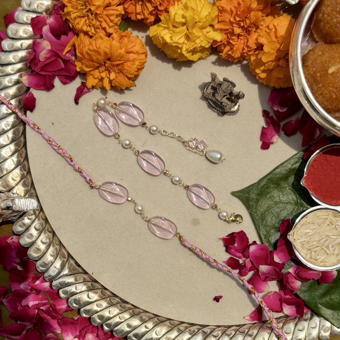 Signity Pearl & Pink Quartz Rakhi Pair